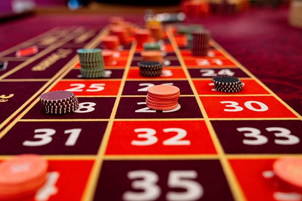 Blackjack table with dealer and live cards